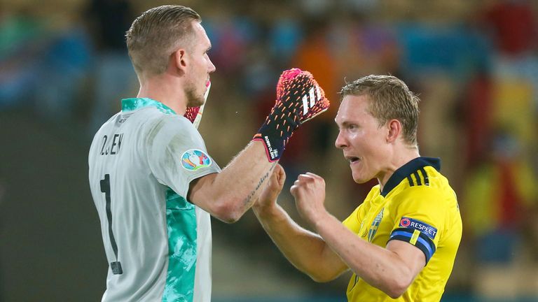 Robin Olsena and Ludwig Augustinsson celebrate Sweden's point