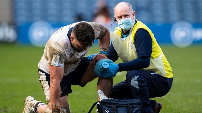 EDINBURGH, SCOTLAND - MARCH 20: Scotland's Rory Sutherland is treated for an injury by Dr James Robson during the Guinness Six Nations match between Scotland and Italy at BT Murrayfield on March 20, 2021, in Edinburgh, Scotland. (Photo by Paul Devlin / SNS Group)