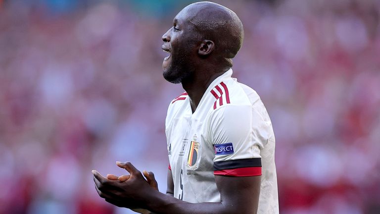 Belgium's Romelu Lukaku applauds during the break at the tenth minute to honour Denmark's Christian Eriksen during the Euro 2020 soccer championship group B match between Denmark and Belgium at Parken stadium in Copenhagen, Thursday, June 17, 2021. (Friedemann Vogel/Pool via AP)