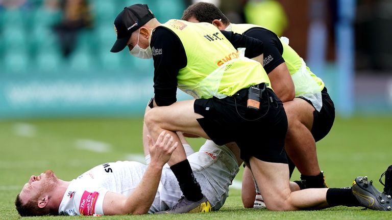 Sam Simmonds receives treatment after suffering an ankle injury