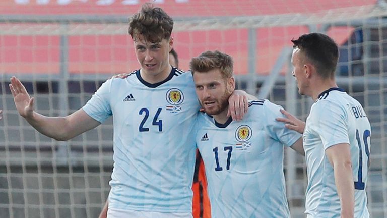 Scotland's Jack Hendry, 2nd left, celebrates with team mates after scoring his side's opening goal during the international friendly soccer match between the Netherlands and Scotland at the Algarve stadium outside Faro, Portugal, Wednesday June 2, 2021. (AP Photo/Miguel Morenatti)