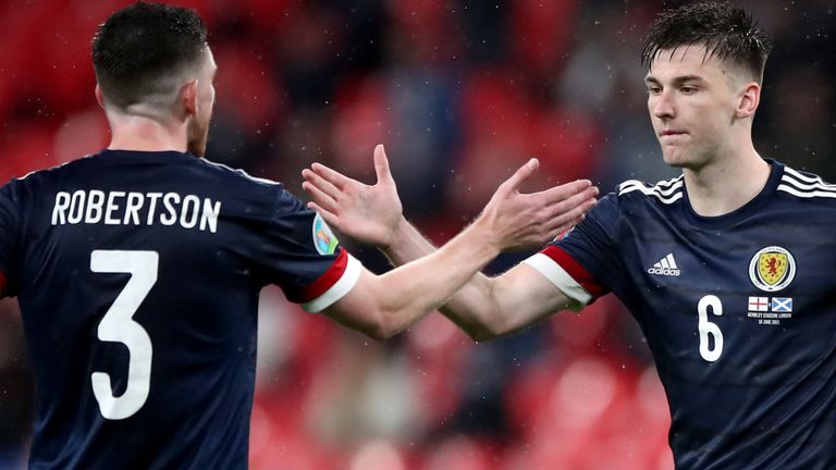 Andy Robertson and Kieran Tierney celebrate Scotland's goalless draw with England at Wembley (PA)