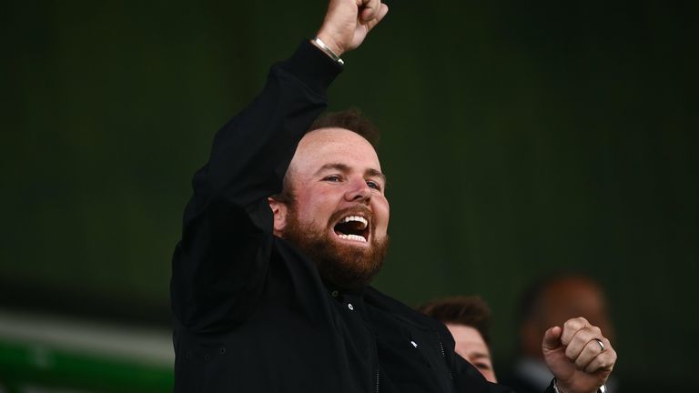 Shane Lowry cheers on from the stands