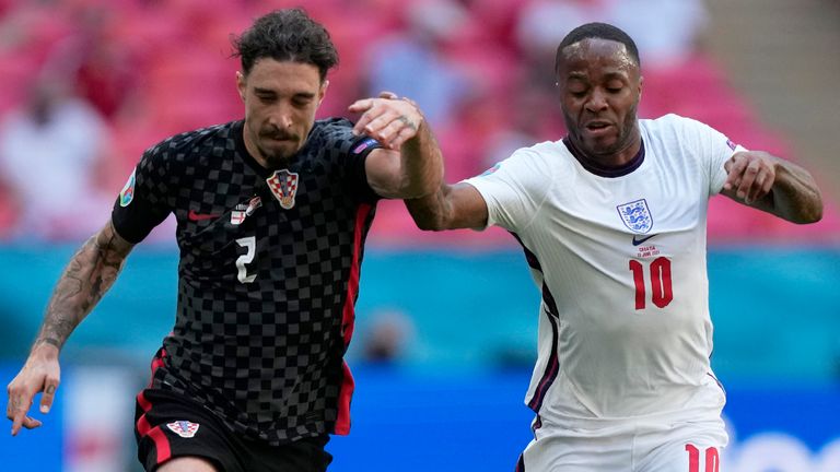 Sime Vrsaljko and Raheem Sterling battle for the ball