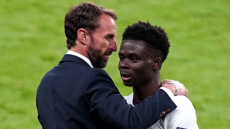 Gareth Southgate and Bukayo Saka (PA)