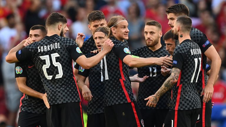 Croatia players celebrates after scoring their side's opening goal scored with an own goal by Spain's goalkeeper Unai Simon during the Euro 2020 soccer championship round of 16 match between Croatia and Spain at the Parken Stadium in Copenhagen