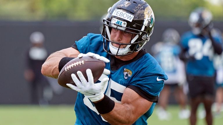 Jacksonville Jaguars tight end Tim Tebow catches a pass during NFL football practice, Thursday, May 27, 2021, in Jacksonville, Fla.