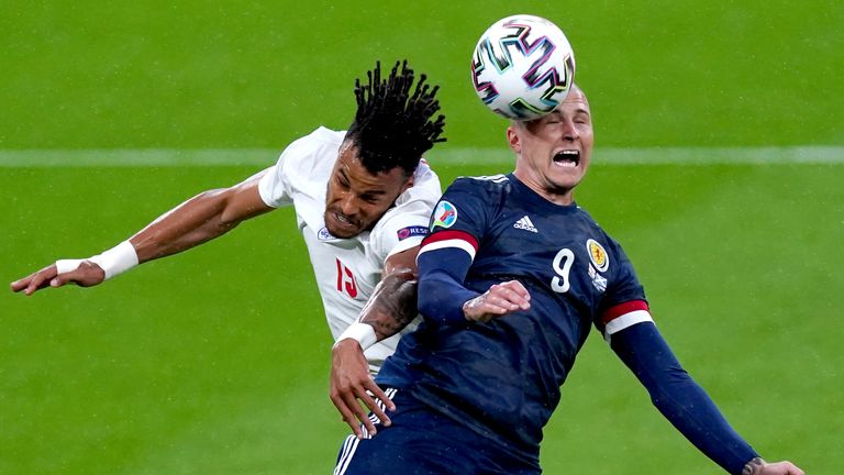 Tyrone Mings and Scotland's Lyndon Dykes battle for the ball during England vs Scotland
