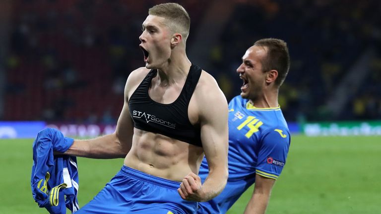 Artem Dovbyk celebrates his late winner with Ukraine team-mate Yevhen Makarenko