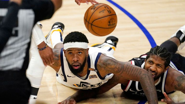 Utah Jazz forward Royce O&#39;Neale, left, and Los Angeles Clippers guard Paul George go after a loose ball during the second half in Game 6 of a second-round NBA basketball playoff series Friday, June 18, 2021, in Los Angeles. (AP Photo/Mark J. Terrill)