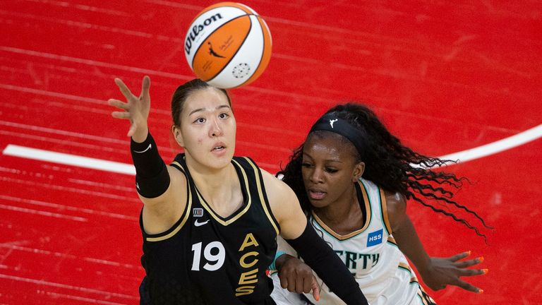 Las Vegas Aces center JiSu Park (19) reaches for control of the ball while New York Liberty forward Michaela Onyenwere (12) defends during a WNBA basketball game Tuesday, June 15, 2021, in Las Vegas.