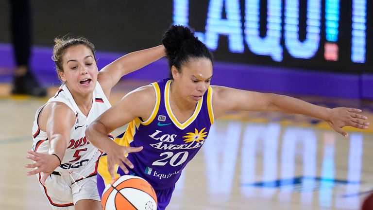 Los Angeles Sparks guard Kristi Toliver, right, dribbles past Washington Mystics guard Leilani Mitchell during the second half of a WNBA basketball game Thursday, June 24, 2021, in Los Angeles.(AP Photo/Marcio Jose Sanchez)


