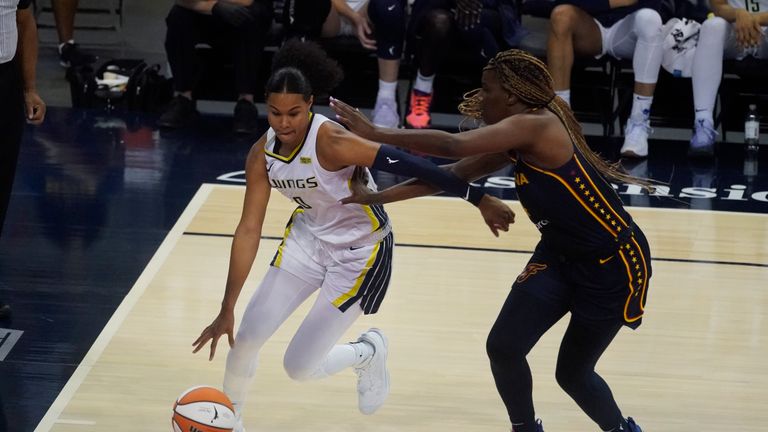 Dallas Wings&#39; Satou Sabally (0) goes to the basket against Indiana Fever&#39;s Jantel Lavender (14) during the second half of a WNBA basketball game, Thursday, June 24, 2021, in Indianapolis. (AP Photo/Darron Cummings)


