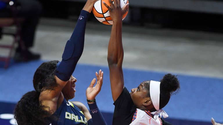 Connecticut Sun forward Kaila Charles blocks a shot attempt by Dallas forward Kayla Thornton during a WNBA basketball game Tuesday, June 22, 2021, at Mohegan Sun Arena in Uncasville, Conn.