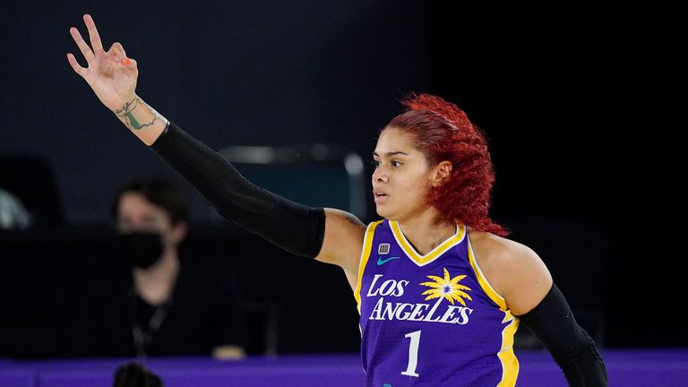 Los Angeles Sparks center Amanda Zahui B gestures after hitting a three-point shot