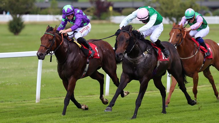 Phoenix Star (centre) ridden by Oliver Stammers on the way to winning the Coral 'Beaten-By-A-Length' Free Bet Handicap on Coral-Eclipse Day of The Coral Summer Festival 2021 at Sandown Park racecourse, Esher.