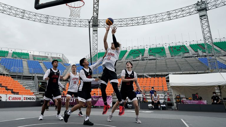 Athletes compete during the Tokyo 2020 Olympic Game men's basketball 3x3 test event Sunday, May 16, 2021 at Aomi Urban Sports Park in Tokyo. (AP Photo/Eugene Hoshiko)