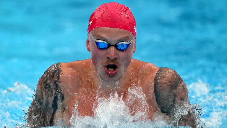 Adam Peaty, of Great Britain, swims in his heat of the men&#39;s 100m breaststroke at the 2020 Summer Olympics, Saturday, July 24, 2021, in Tokyo, Japan