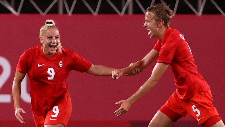 Adriana Leon of Team Canada celebrates with team-mate Quinn after scoring against Team GB