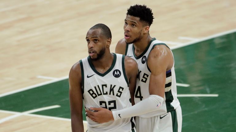 Milwaukee Bucks forward Khris Middleton celebrates with teammate forward Giannis Antetokounmpo at the end of Game 4 against the Phoenix Suns in the NBA Finals