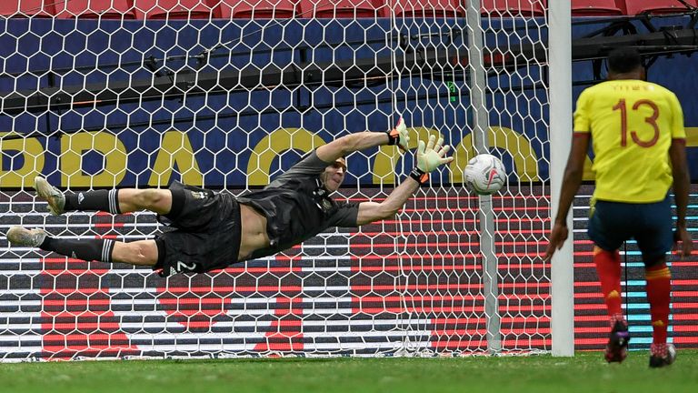 Argentina goalkeeper Emiliano Martinez saves Yerry Mina's penalty