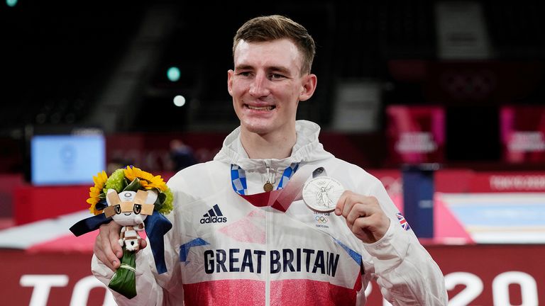 Britain's Bradly Sinden a silver medal during the medal ceremony for the taekwondo men's 68kg match at the 2020 Summer Olympics, Sunday, July 25, 2021, in Tokyo, Japan.
