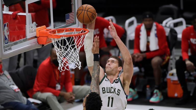 Milwaukee Bucks&#39; Brook Lopez shoots against Atlanta Hawks&#39; John Collins during the second half of Game 5 of the NBA Eastern Conference Finals 