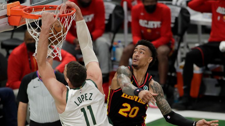 Milwaukee Bucks&#39; Brook Lopez dunks against Atlanta Hawks&#39; John Collins during the second half of Game 5 of the NBA Eastern Conference Finals