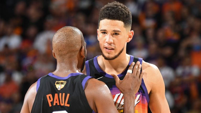 Chris Paul and Devon Booker celebrate Phoenix&#39;s win in Game 2 of the NBA Finals