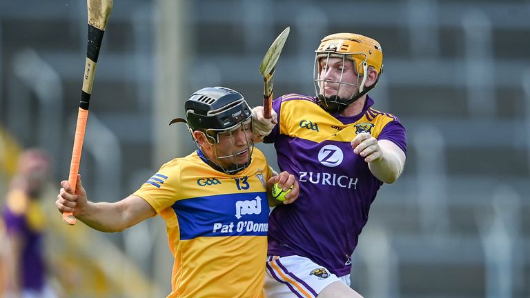 David Reidy of Clare in action against Simon Donohoe of Wexford