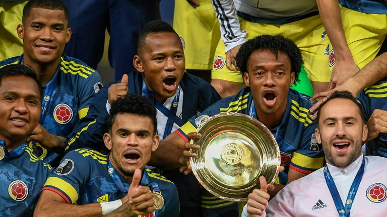 Colombia celebrate with the third-place trophy at the Copa America 