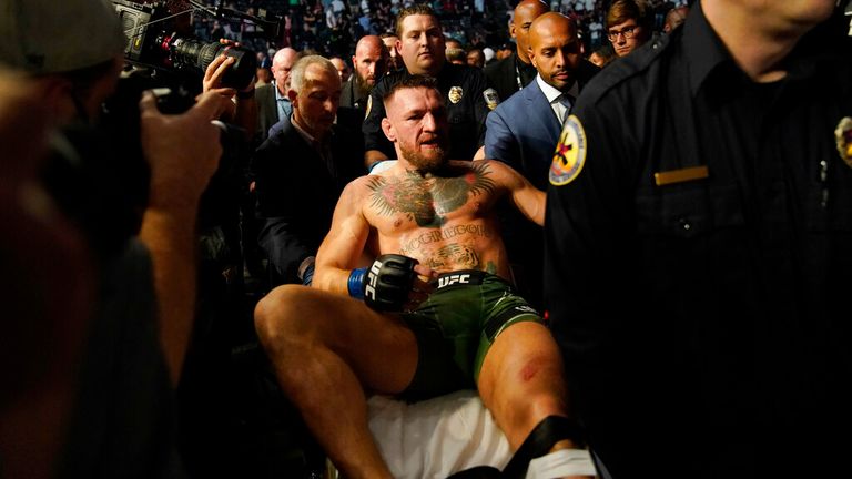 Conor McGregor is carried off on a stretcher after losing to Dustin Poirier in a UFC 264 lightweight mixed martial arts bout Saturday, July 10, 2021, in Las Vegas. (AP Photo/John Locher)