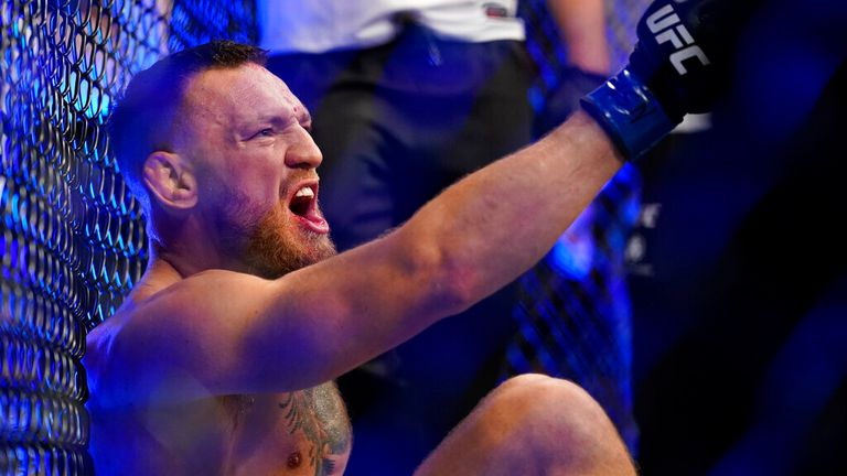 Conor McGregor yells as he sits on the mat after an injury during his lightweight mixed martial arts bout with Dustin Poirier at UFC 264 on Saturday, July 10, 2021, in Las Vegas. (AP Photo/John Locher)