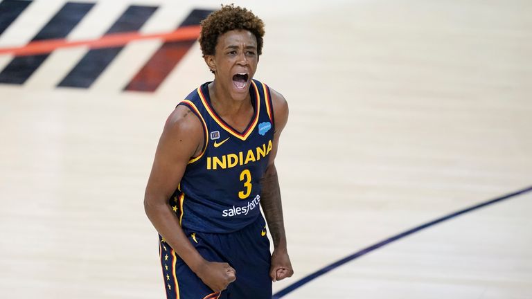 Indiana Fever&#39;s Danielle Robinson celebrates in a WNBA basketball game