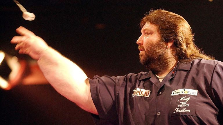 Andy Fordham launches his dart during the head-to-head showdown against Phil 'The Power' Taylor at Circus Tavern, Purfleet. Fordham has the disadvantage of playing with a broken wrist.