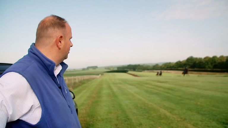 Menuisier surveys his team on the gallops at his West Sussex base
