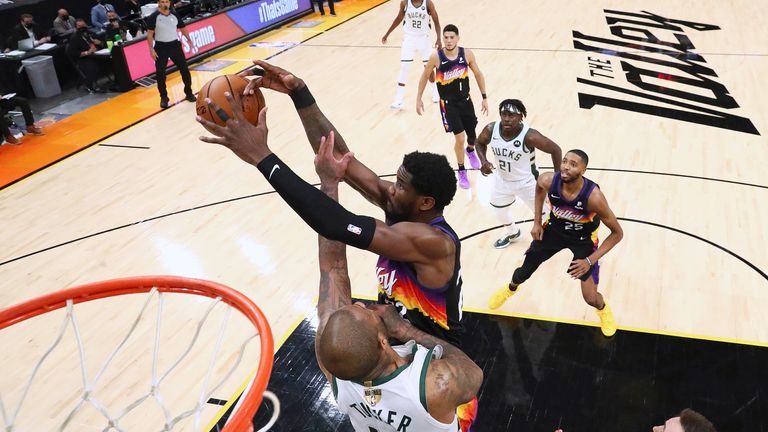 Phoenix Suns center Deandre Ayton (22) plays for the ball against Milwaukee Bucks forward P.J. Tucker (17) during game two of the 2021 NBA Finals at Phoenix Suns Arena. Mandatory Credit: Mark J. Rebilas-USA TODAY Sports