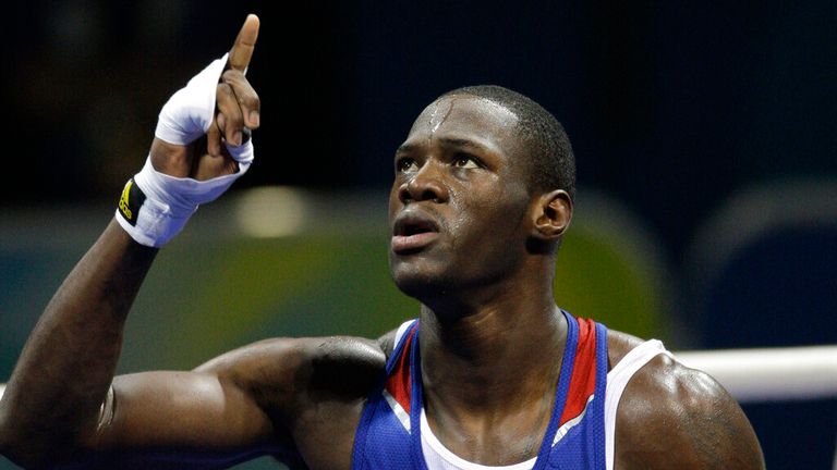 USA's Deontay Wilder reacts after defeating Abdelaziz Touilbini of Algeria in a men's heavyweight 91-kilogram preliminary boxing match at the Beijing 2008 Olympics in Beijing, Wednesday, Aug. 13, 2008. (AP Photo/Rick Bowmer).