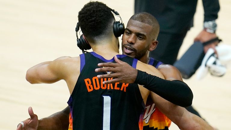 Devin Booker and Chris Paul share an embrace after their Game 1 win