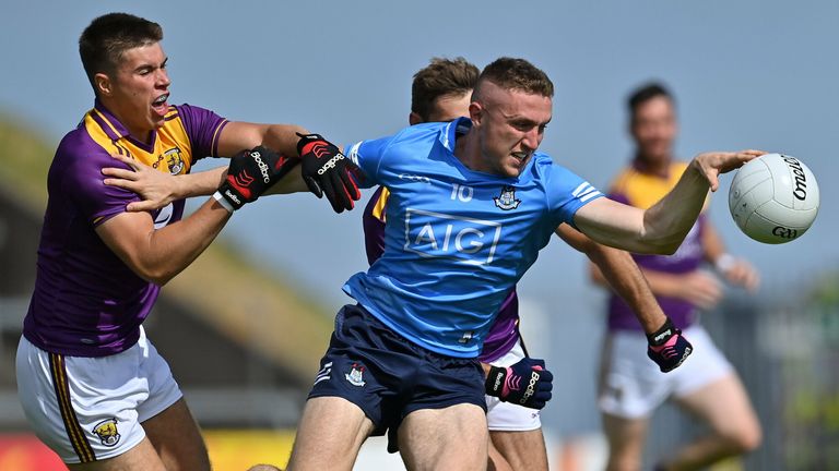 Paddy Small of Dublin in action against Brian Malone and Eoin Porter of Wexford