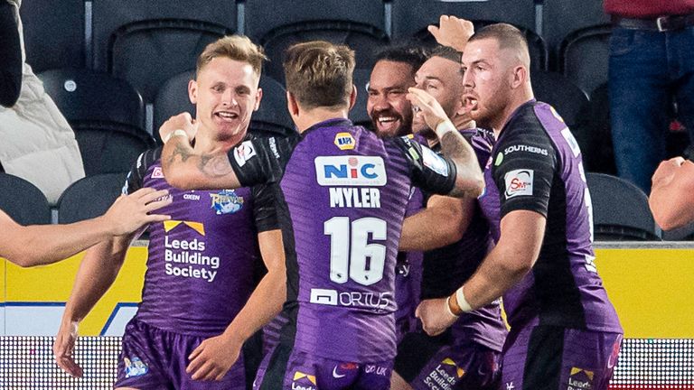 Leeds celebrate Brad Dwyer's (left) crucial try at Hull on Thursday 