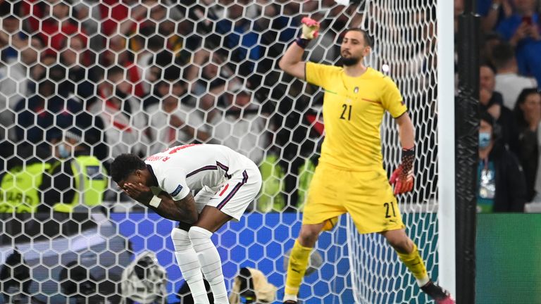 England&#39;s Marcus Rashford reacts after missed a penalty shot during the penalty shootout during the Euro 2020 soccer final match between England and Italy at Wembley 