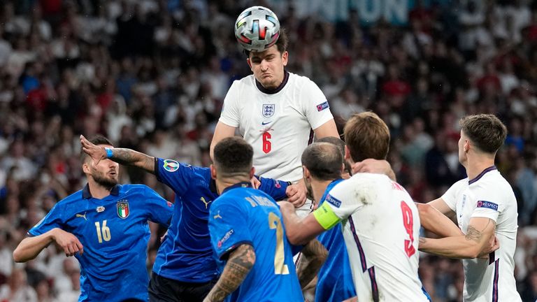 England's Harry Maguire heads over against Italy
