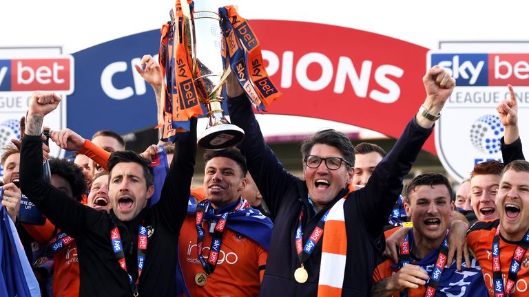 Luton Town manager Mick Harford (centre right) and team celebrate winning Sky Bet League One in 2019