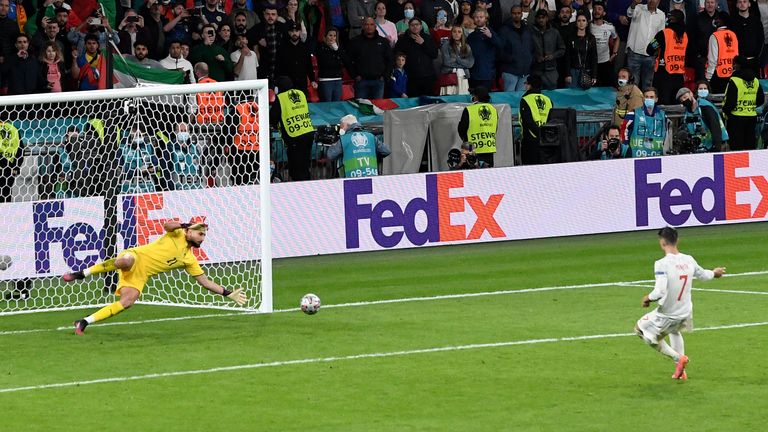 Italy&#39;s goalkeeper Gianluigi Donnarumma stops a penalty shot from Spain&#39;s Alvaro Morata during a penalty shootout at the end of during the Euro 2020 soccer championship semifinal match between Italy and Spain at Wembley 