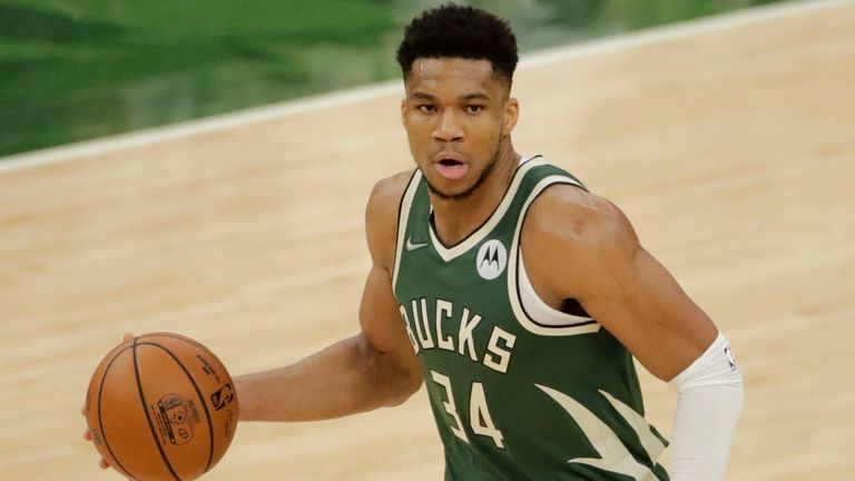 Milwaukee Bucks' Giannis Antetokounmpo dribbles during the second half of Game 3 of basketball's NBA Finals against the Phoenix Suns Sunday, July 11, 2021, in Milwaukee. (AP Photo/Aaron Gash)