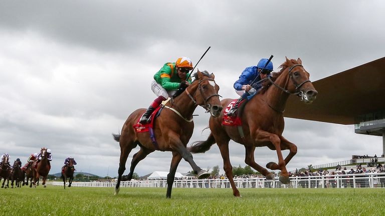 Hurricane Lane battles past Lone Eagle at the Curragh, with the front two well clear of the rest of the field