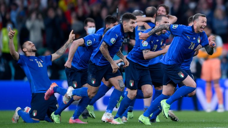 Italy players celebrate after Jorginho scored the decisive shootout penalty, during the Euro 2020 soccer semifinal match between Italy and Spain at Wembley 