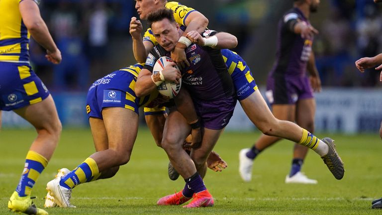 Leeds forward James Donaldson takes on the Warrington defence