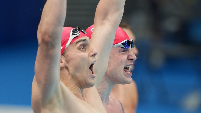 James Guy and Adam PEaty celebrate another swimming gold medal for Britain